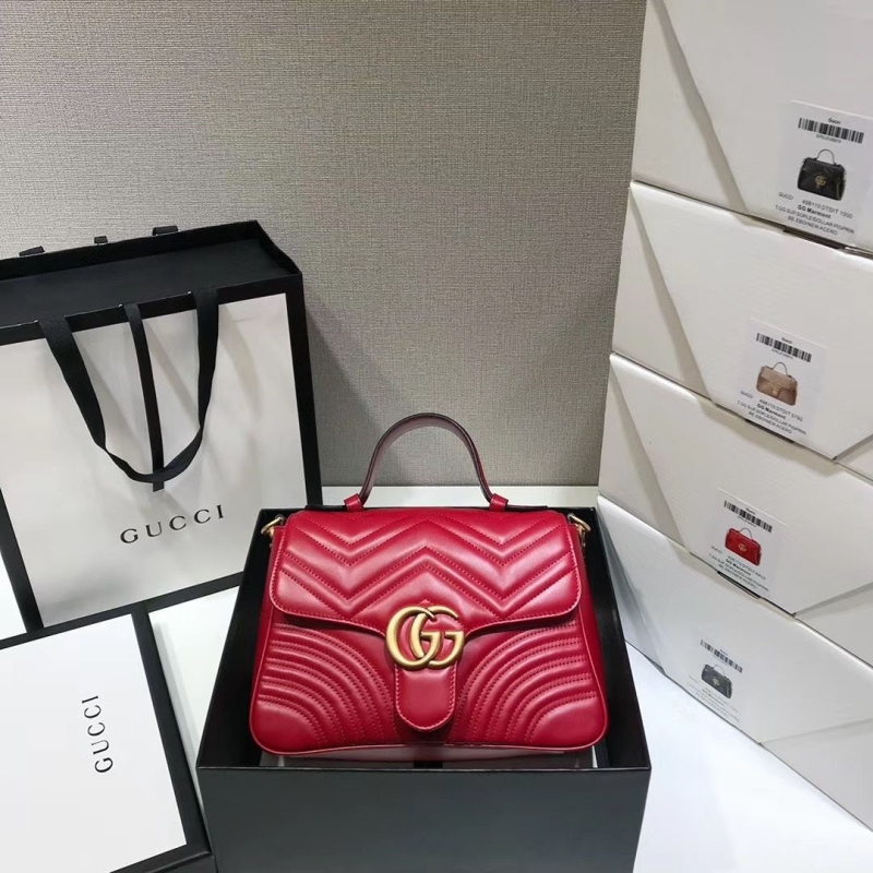 G*u*i top handle bags